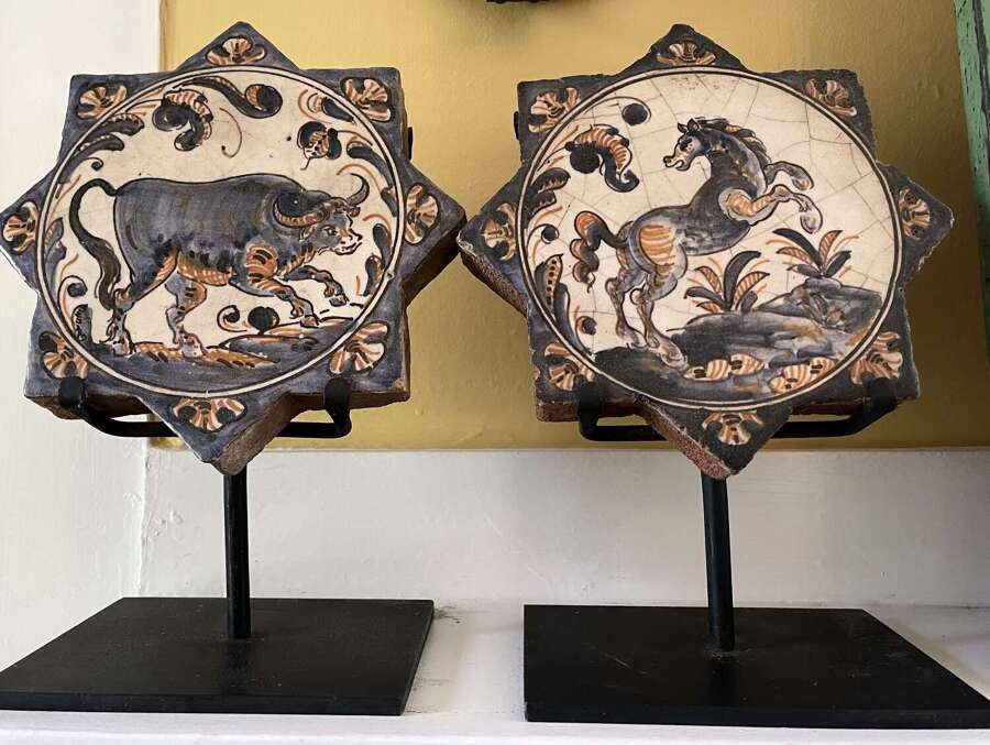 Pair of Antique Spanish Talavera Faience Star Tiles with Animal Motifs