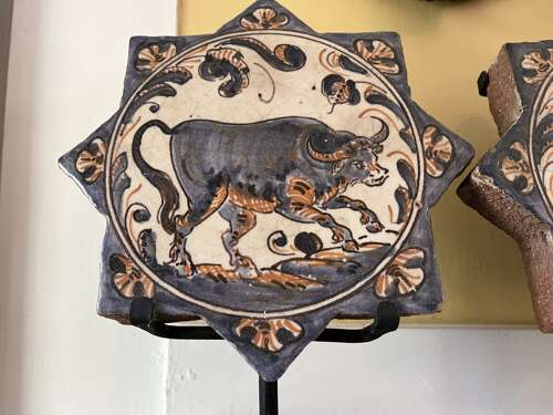 Pair of Antique Spanish Talavera Faience Star Tiles with Animal Motifs