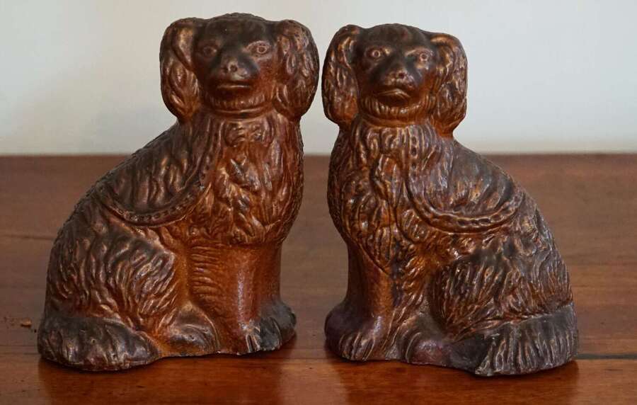 Pair of antique American sewer tile pottery spaniels