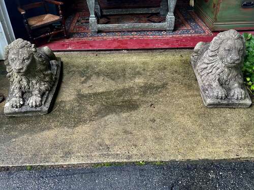 Pair of reconstituted limestone lions France, circa 1920.