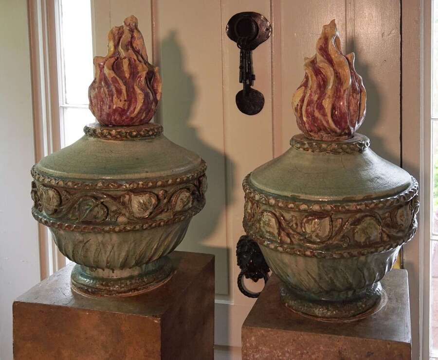 Pair of Neoclassical French flame urns on base