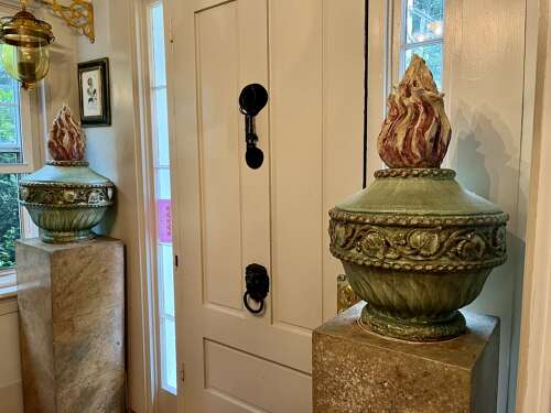 Pair of Neoclassical French flame urns on base
