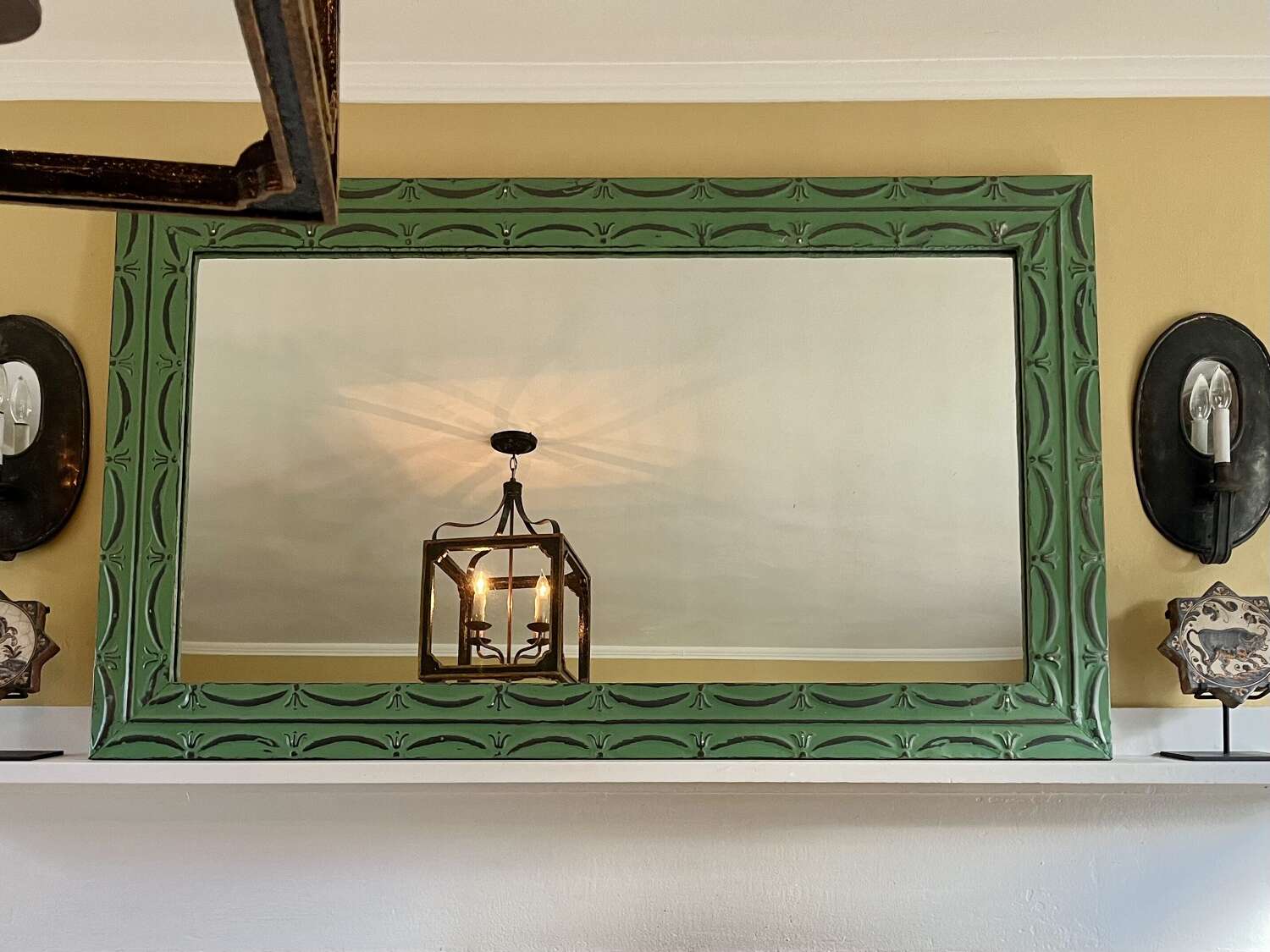 Pair of vintage green painted zinc mirror with embossed tin frame