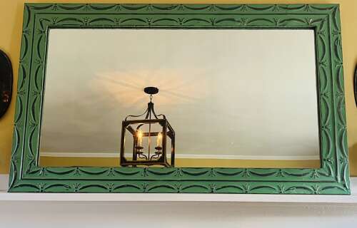 Pair of vintage green painted zinc mirror with embossed tin frame