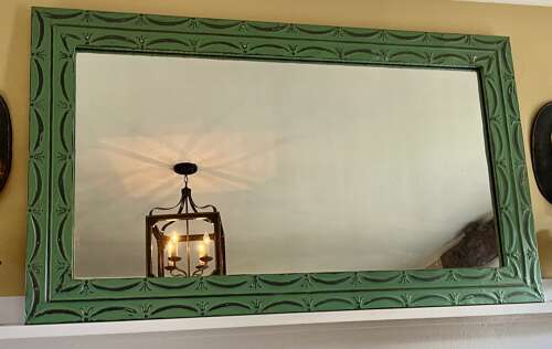 Pair of vintage green painted zinc mirror with embossed tin frame
